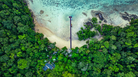 An amazing bird's eye view of Ao Mai Ngam, Surin Islands. There is a pier opposite the beach where the accommodation is. There are coral reefs and schools of fish. It is a destination for divers.の写真素材