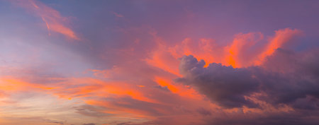 Aerial view of a colorful pink sky at twilight above the ocean. A romantic scene with a bright sky...