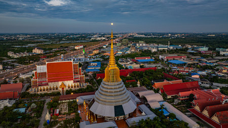 Aerial view of a magnificent golden pagoda surrounded by temple buildings.の写真素材