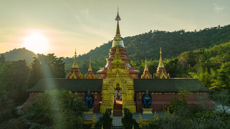 aerial view of the golden gate with intricate golden architecture at Phra Yai Wat Phra That Doi Phra...