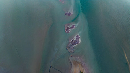 Amid the shallow coastal waters and mangrove forests, a deepwater channel winds its way toward the...