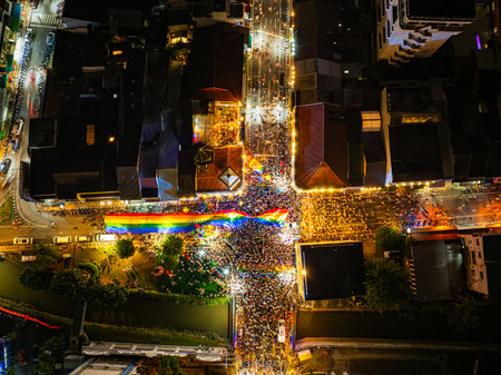 Aerial top view of a large gathering at night in Phuket Town. A large number of people attended the event at Phuket's Chater intersectionの写真素材