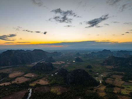 The aerial sunset landscape evokes tranquility and adventure, showcasing the timeless beauty of...