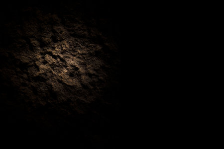 Dark stone wall texture background for design with copy space for text or image.の写真素材