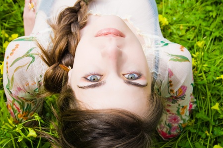portrait of beautiful young hippie and staring at the camera upside down 