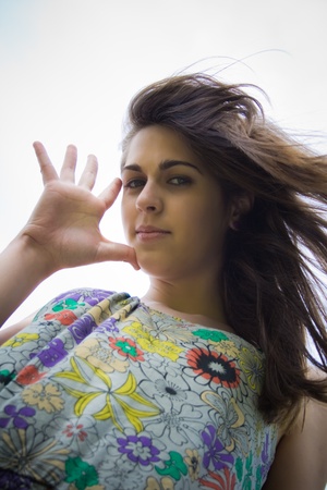 pretty young girl looking at the camera with a look fun 