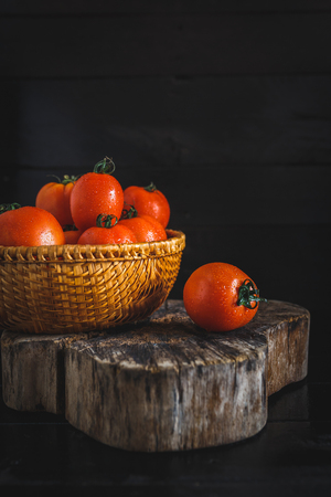 Red Tomatoes on the dark backgroundの写真素材