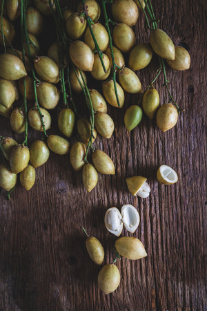 Baccaurea ramiflora fruits on the old woodの写真素材