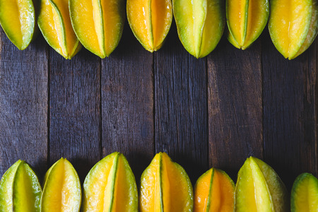 Star fruits on the old woodの写真素材