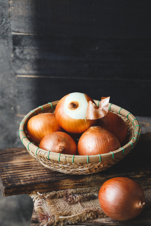 Fresh Onions on the old woodの写真素材