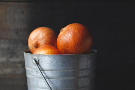 Fresh Onions on the old woodの写真素材