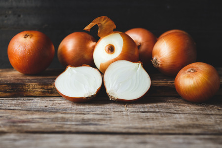 Fresh Onions on the old woodの写真素材