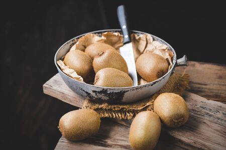 Fresh kiwi  on the old woodの写真素材
