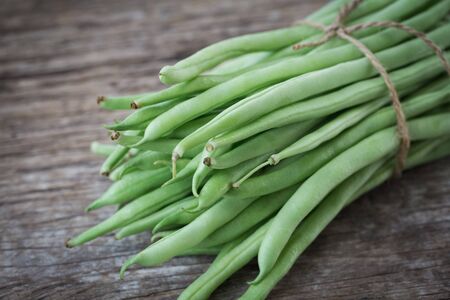 Fresh French beans-Green beans on the old wood backgroundの写真素材
