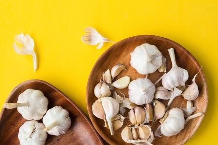 Garlic bulb-Garlic clove on the yellow background