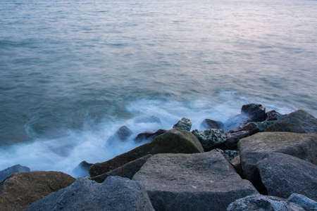 Sea waves lash line impact rock .の写真素材