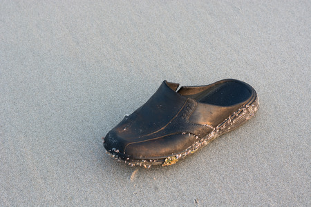 Old shoes on the beachの写真素材