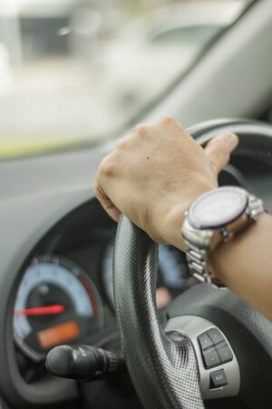 People are driving, close-up hands.の写真素材