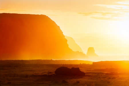 Fallen moai in golden morning haze in Easter Islandの写真素材