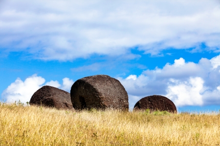 Three moai hats on field in Easter Island in sunlightの写真素材