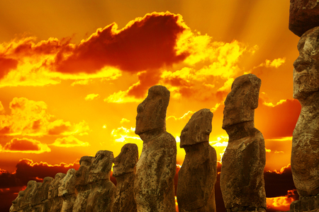 Standing moais at Ahu Tongariki in Easter Island at gloden sunsetの写真素材