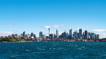 Sydney city skyline seen from the sea on a sunny dayの写真素材