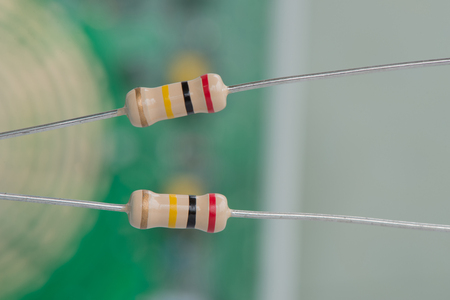 Closeup 200K or 200,000 Ohms resistors against electronic board.の写真素材