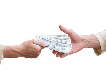 Money cash background. Human hands exchanging money closeup shot.の写真素材
