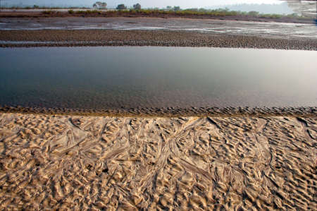 The natural design, shape and form on the earth due to different reasons in a river bank.の写真素材