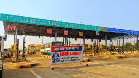 November 2020- Mahroli, Jaipur, India / Vehicles passing through toll plaza. Checkout point on the National highway.のeditorial素材