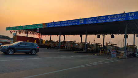 02 November 2020 : Reengus, Jaipur, India. Vehicles passing through Toll Tax booth on NH 52 India.のeditorial素材