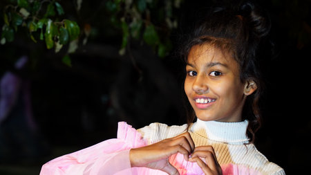 19 February 2021- Sikar, Jaipur, India. Love concept. Adorable closeup shot of pretty girl, making Heart shape with fingers.のeditorial素材