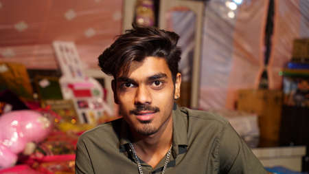 19 February 2021- Sikar, Jaipur, India. Joyful Indian boy wearing casual shirt posing shot in front of Camera. Smiling face of young Indian boy.のeditorial素材