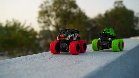High speed truck toy for kid playing. Plastic toy with modern stylish design and big wheels closeup.の写真素材