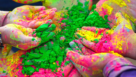 Colorful holi painted hands in different positions. Holi vibrant colors with attractive color dye.の写真素材