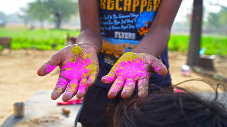 24 March 2021- Khatoo, Jaipur, India. Human hand with pink color powder on Holi event. Festive season of Rangpanchmi or Holi festival concept.の写真素材