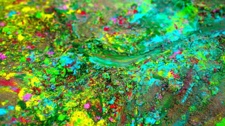 Holi colors and rangoli scattering on ground. Holi color powders closeup with herbal flower rose dye.の写真素材