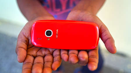 26 March 2021- Khatoo, Jaipur, India. Back side shot of Red Nokia mobile phone with camera icon. Man...