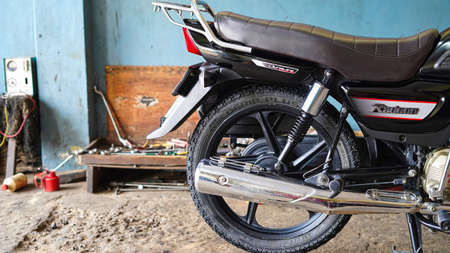 05 October 2021 Reengus, Rajasthan, India. Tvs Radeon rear body parts photo. Two wheeler body parts like tyre, fork, back light etc.のeditorial素材