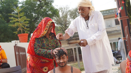 21 November 2021 Reengus, Rajasthan, India. Old Indian senior citizen celebrate grandson's wedding rituals.のeditorial素材