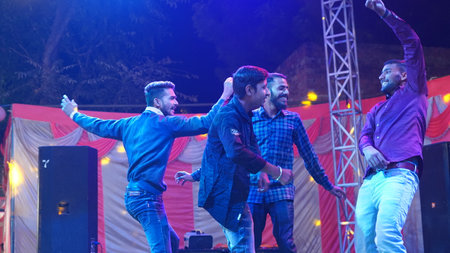 21 November 2021 Reengus, Rajasthan, India. Young people dancing on floor. Indian wedding parties...