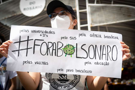 Salvador, Bahia, Brazil - May 29, 2021: Protesters protest against President Jair Bolsonaro's government through the streets of downtown Salvador, Bahia. Everyone wants his exit from the government.のeditorial素材