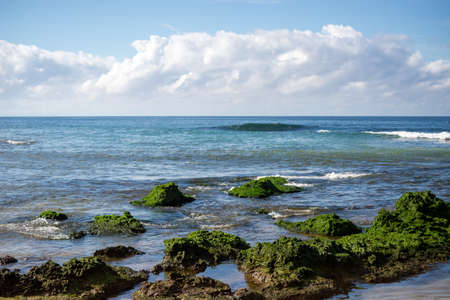 Landscape of the sea breaking on the rocks of Boca do Rio beach. Salvador, Bahia, Brazil.の写真素材