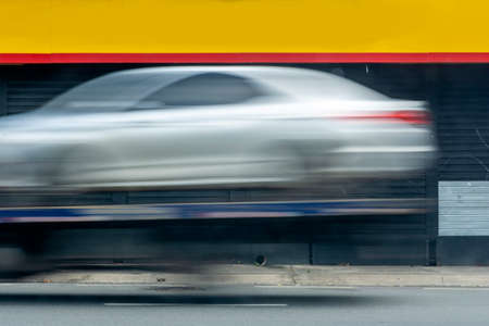Car speeding along the street of Salvador. Bahia Brazil.の写真素材