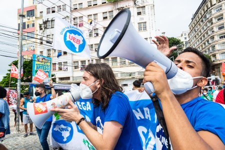 Salvador, Bahia, Brazil - July 24, 2021: Protesters protest against President Jair Bolsonaro's government through the streets of downtown Salvador, Bahia. Everyone wants his exit from the government.のeditorial素材
