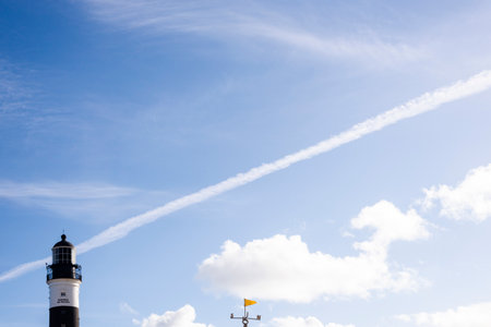 Salvador, Bahia, Brazil - August 08, 2021: Bright blue sky over the famous Farol da Barra. Many...