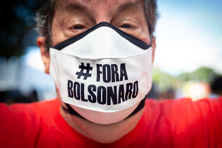 Salvador, Bahia, Brazil - May 29, 2021: Protesters protest against President Jair Bolsonaro's government through the streets of downtown Salvador, Bahia. Everyone wants his exit from the government.のeditorial素材