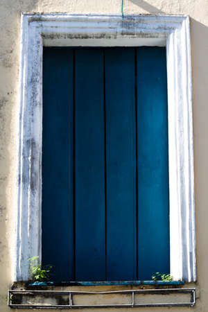Antique door details in color with shadow, iron, cement, wood.Pelourinho, Salvador, Bahia, Brazil.の写真素材