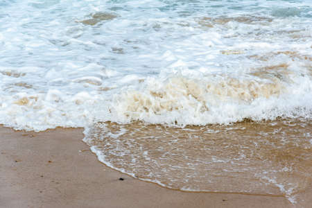 Waves lapping the sands of Ponta do HumaitÃ¡ beach. Salvador Bahia Brazil.の写真素材