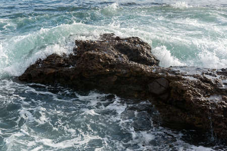 Waves breaking on the rocks of Ponta do HumaitÃ¡. Salvador Bahia Brazil.の写真素材